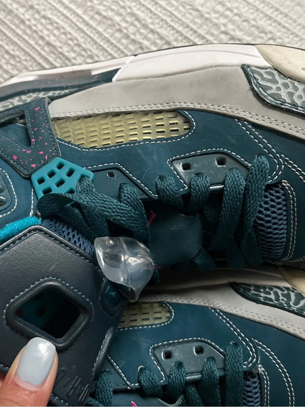 Jordan Spizike Space Teal and Gray Sneakers with Pink Accent.